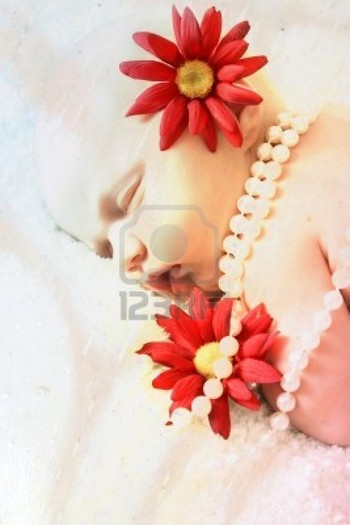 8913889-beautiful-newborn-baby-girl-with-flowers-and-pearls-layers-property-of-photographer