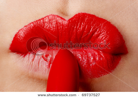 stock-photo-the-woman-draws-lips-lipstick-69737527