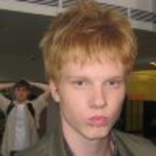 MV5BMTg1NTI2NjEwNl5BMl5BanBnXkFtZTcwMzMzNDU4Mw@@._V1._CR0,0,926,926_SS100_ - Adam Hicks