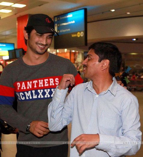 199011-sushant-singh-rajput-with-event-manager-at-south-africa-airport - Sushant Singh Rajput