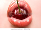 stock-photo-young-woman-mouth-with-red-cherry-closeup-36189571