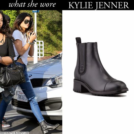 kylie jenner in black leather ankle chelsea chanel boots with blue jeans and white shirt on january 