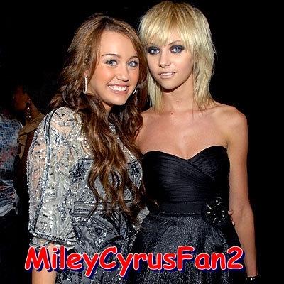 NRJYBEPNMDARPBLCTPQ - Miley Cyrus and her friend