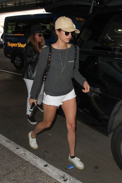 nina-dobrev-leggy-in-shorts-at-lax-airport-in-los-angeles-3-6-2017-10 - nina dobrev