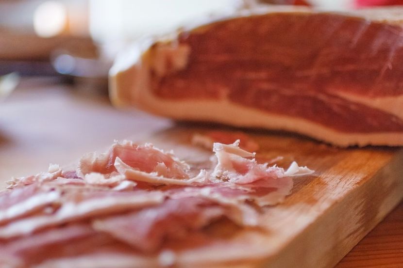 close-up-of-cured-ham-on-chopping-board-738786073-5a67d337ff1b780037e575d7 - MARIETA BADESCU - ex SIRETEANU- sotie legitima pe timp limitat