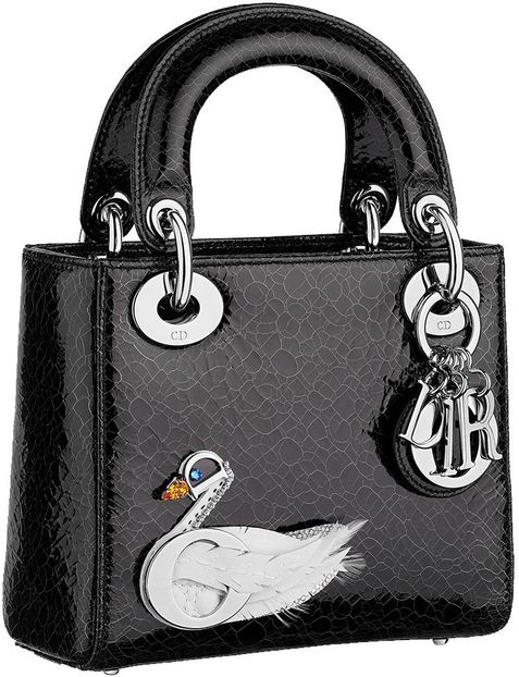 Lucy received a Lady Dior Jewelled Swan bag from Travis. - Secret Santa is coming to town