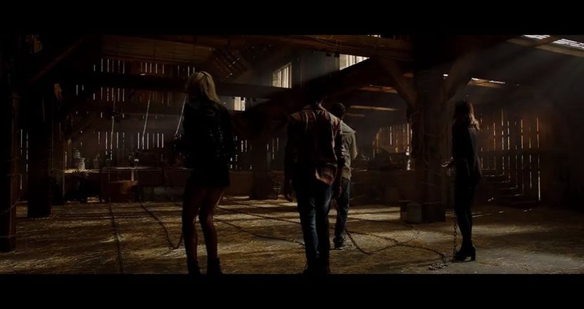 open with a groan, revealing eight empty metal chairs—perfectly arranged in a circle—and above - The Devil is a Gentleman