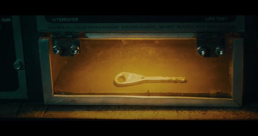 revealing a small brass key. But before anyone can move, the mirror flashes—and a holographic - The Devil is a Gentleman
