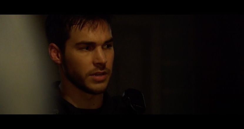 Beneath his ribs, a small circular device is lodged deep in the muscle—its light flickering - The Devil is a Gentleman