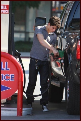 Nick Jonas pumping gas in L A