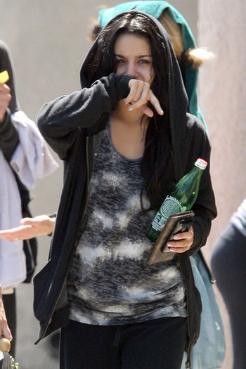 Vanessa+Hudgens+hides+face+behind+arm+leaves+IMIic97XQHgl