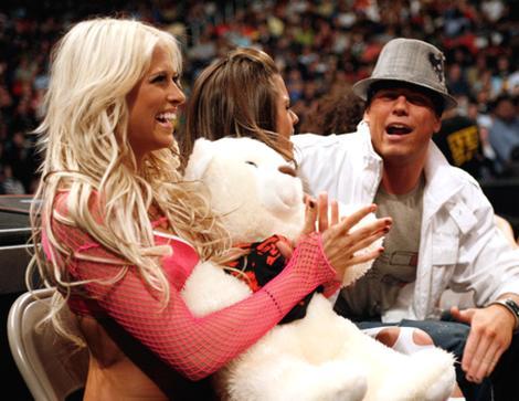 Kelly Kelly with teddy bear ringside