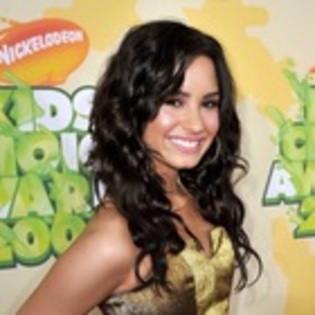 demi_lovato_at_the_kids_choice_awards_2009_orange - Demi Lovato Attends 2009 Kids Choice Awards