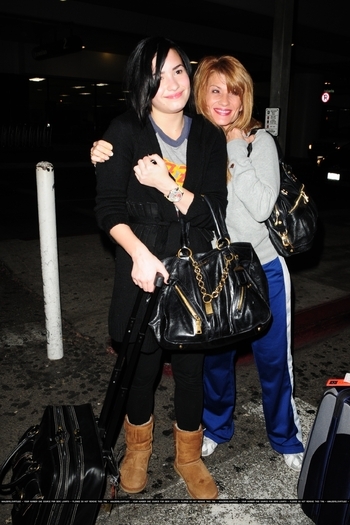 17670666_ZFOBJIJMR - Demi Lovato At LAX Airport