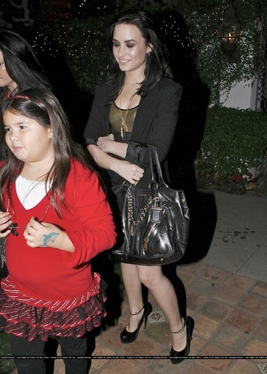 17670147_DTMRDGGRZ - Demi Lovato is Heading to George Lopez Christmas party in Los Angeles