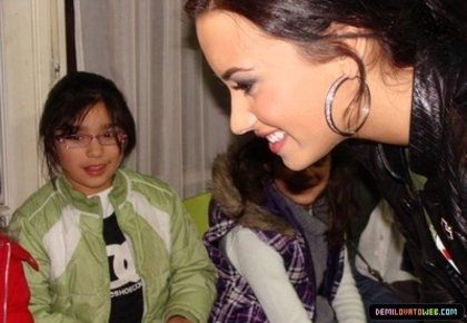 normal_002 - Demi Lovato 05-22-10 Visiting Red Cross in Chile