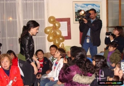 normal_008 - Demi Lovato 05-22-10 Visiting Red Cross in Chile