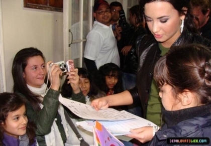 normal_022 - Demi Lovato 05-22-10 Visiting Red Cross in Chile