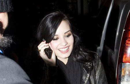 Demi-Lovato-Takes-Call-With - Demi Lovato s phone