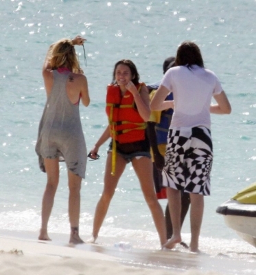 beachjetskiinbahamas130509-07 - Miley Cyrus Rides The Banana Boat