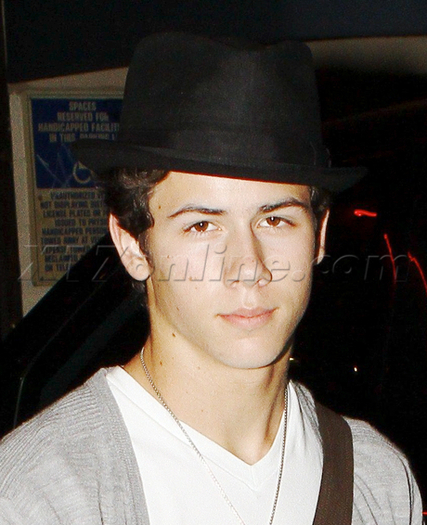 Nick-Jonas-Covers-Up-His-Curly-locks-nick-jonas-16269478-460-566 - Covers up his curly look