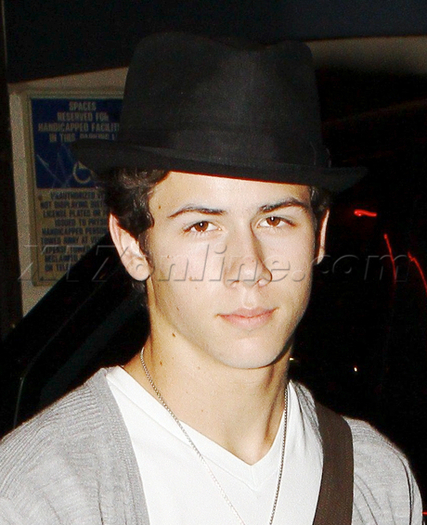 Nick-Jonas-Covers-Up-His-Curly-locks-nick-jonas-16269478-460-566