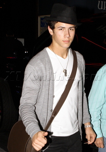 Nick-Jonas-Covers-Up-His-Curly-locks-nick-jonas-16269486-460-657