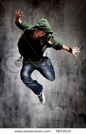 stock-photo-cool-looking-dancer-posing-on-a-grunge-grey-wall-5833633