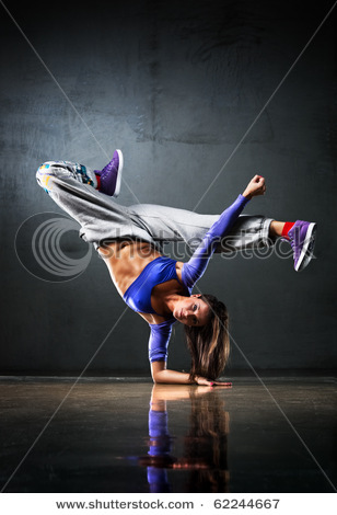 stock-photo-young-woman-dancer-on-wall-background-62244667