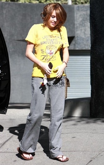  - x Miley Cyrus Arriving Downtown 2009