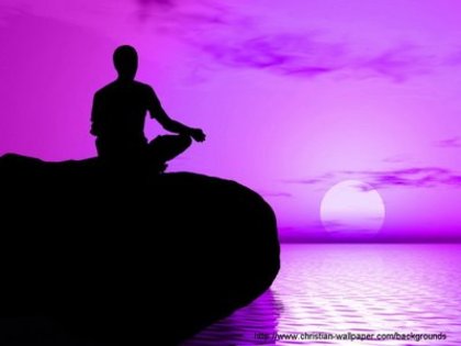 young-boy-in-meditation-position-practicing-yoga-with-violet-sunrise - violet