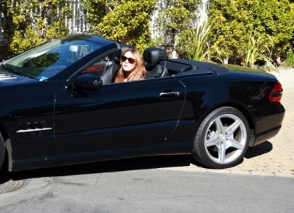 normal_mileylipgloss_(1) - 0-0 Miley Applying Lip Gloss In Her Convertible