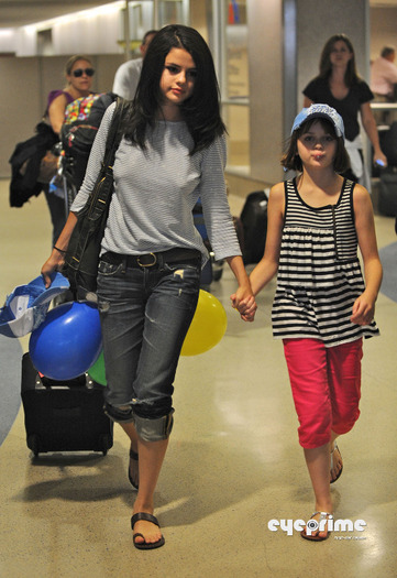 selena_eyeprime_08 - Selena Gomez arrives at LAX  Jul 22  2010