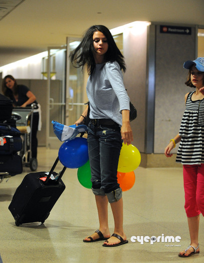 selena_eyeprime_09 - Selena Gomez arrives at LAX  Jul 22  2010