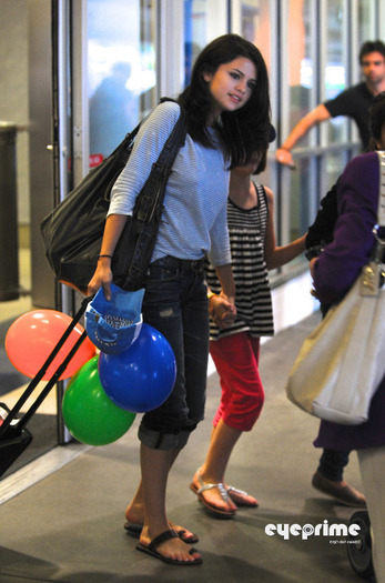 selena_eyeprime_03 - Selena Gomez arrives at LAX  Jul 22  2010