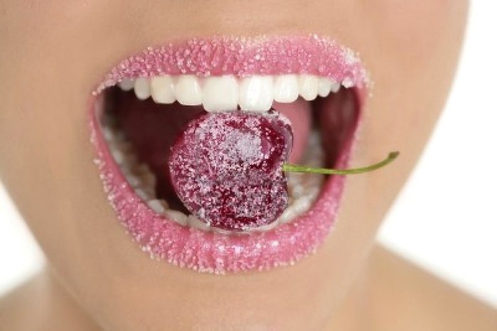 5594436-cherry-with-sugar-lips-between-woman-perfect-teeth-macro-mouth