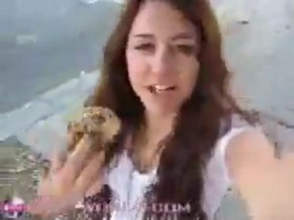   (234) - Miley Cyrus filming herself eating a big cookie - Captures