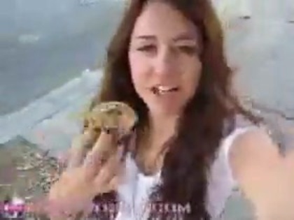   (235) - Miley Cyrus filming herself eating a big cookie - Captures