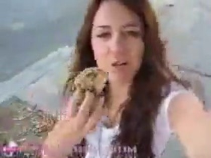   (237) - Miley Cyrus filming herself eating a big cookie - Captures