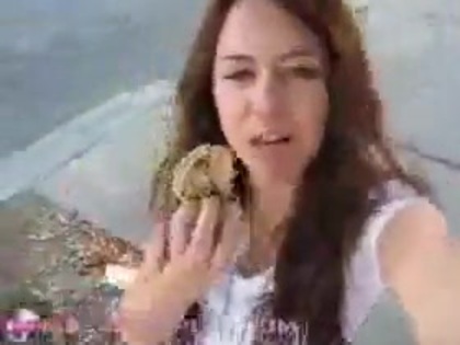   (241) - Miley Cyrus filming herself eating a big cookie - Captures