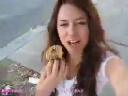   (242) - Miley Cyrus filming herself eating a big cookie - Captures