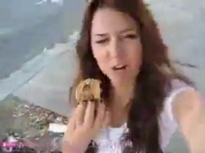   (245) - Miley Cyrus filming herself eating a big cookie - Captures