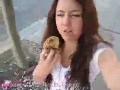   (265) - Miley Cyrus filming herself eating a big cookie - Captures