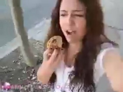   (269) - Miley Cyrus filming herself eating a big cookie - Captures