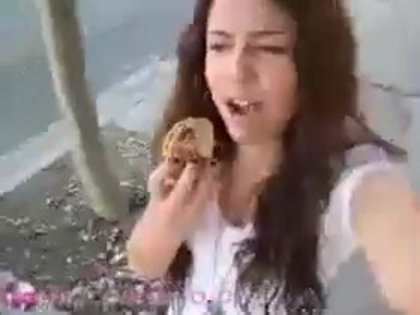  (270) - Miley Cyrus filming herself eating a big cookie - Captures