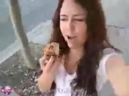   (275) - Miley Cyrus filming herself eating a big cookie - Captures