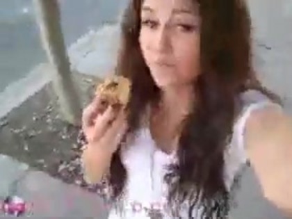   (284) - Miley Cyrus filming herself eating a big cookie - Captures