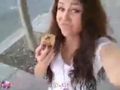   (288) - Miley Cyrus filming herself eating a big cookie - Captures
