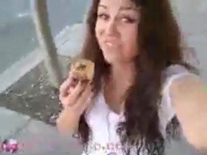   (289) - Miley Cyrus filming herself eating a big cookie - Captures