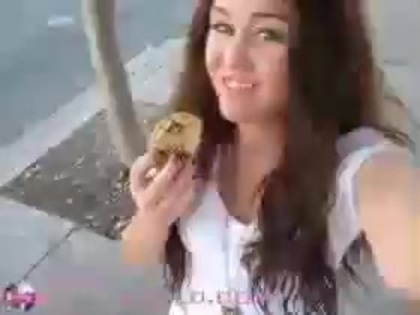   (290) - Miley Cyrus filming herself eating a big cookie - Captures